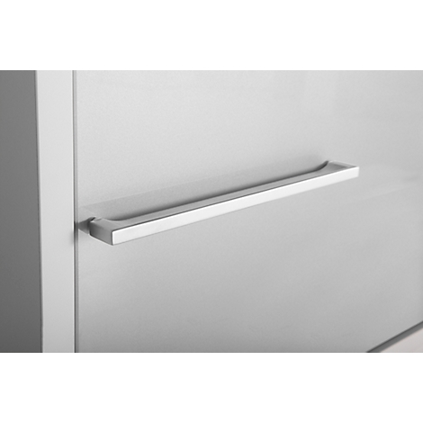 Close-up of a silver handle on a white surface. The handle is flat and rectangular, with rounded edges.