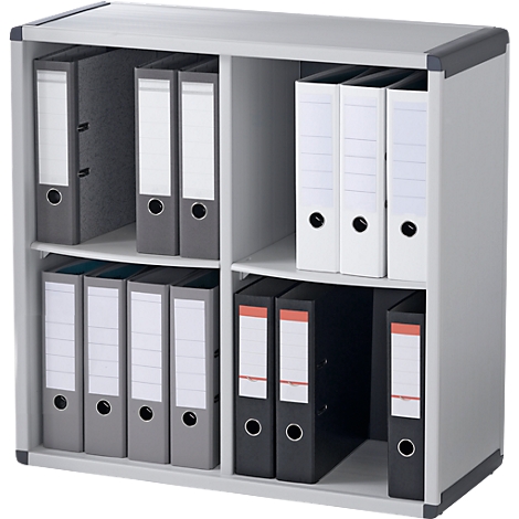 A gray file cabinet, filled with gray and white binders, stands against a white background.