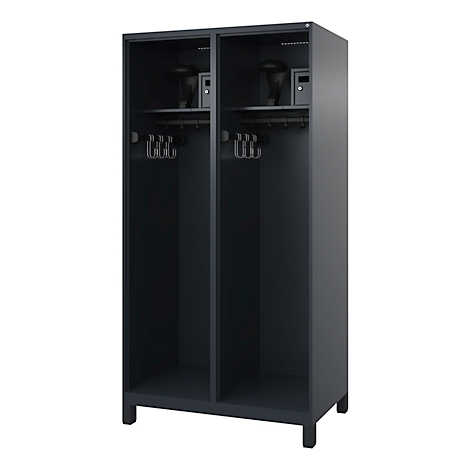 Dark double locker. The locker has coat racks, and shelves with objects. Small safes are placed at the top.