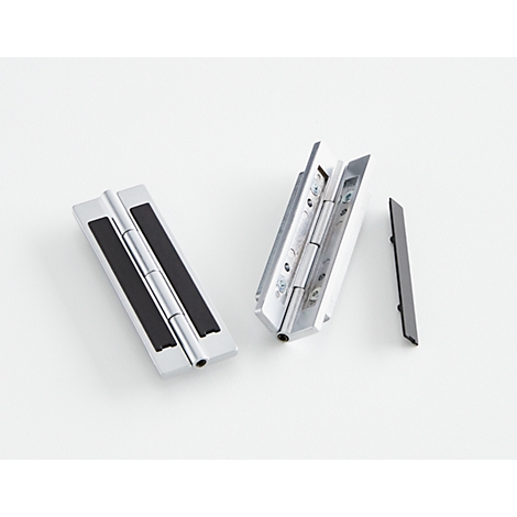 Two metal hinges on a white background. One is closed, the other open. Next to it is a loose black element.