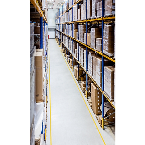 Warehouse with high-bay warehouses full of packages. Yellow marking on the floor. Perspective from above.
