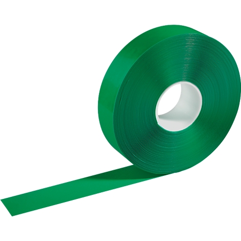 Green Velcro tape, partially unrolled. Rolled-up tape, core white.