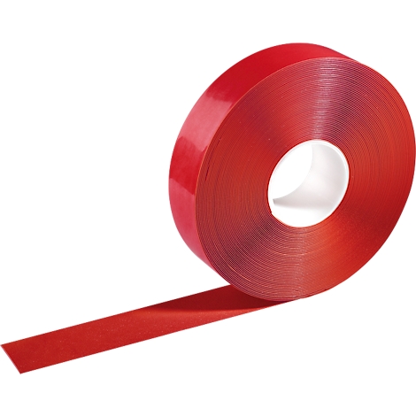Roll of red double-sided adhesive tape being pulled from the roll.