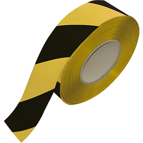 Close-up of a roll of black and yellow striped warning tape.