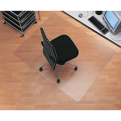 Transparent office chair mat on parquet floor, chair with black seat.