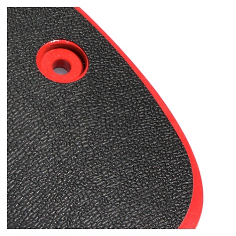 Detailaufnahme einer schwarzen, strukturierten Oberfläche mit rotem Rand und Loch.