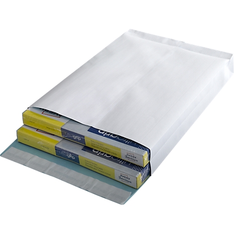 White padded envelope containing two flat boxes. The boxes are partially visible, with yellow and blue accents and writing.