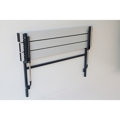 Grey folding table mounted on the wall with black frame. The table is folded.