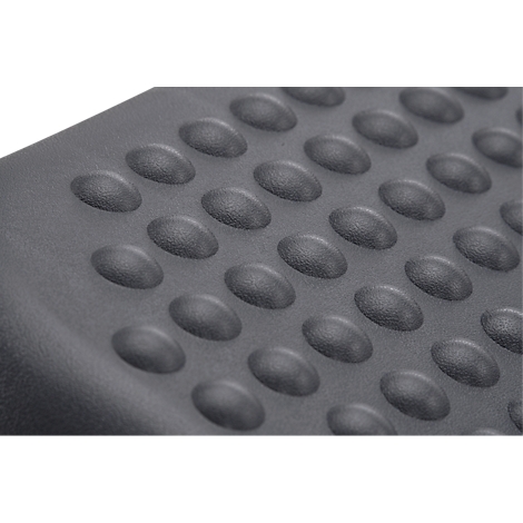 Gray surface with raised, oval studs.
