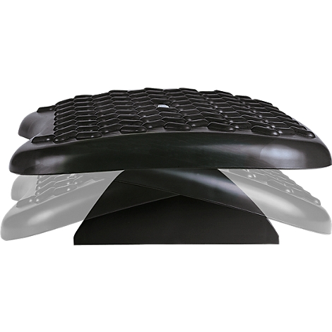 Black footrest, photographed diagonally from below. The top is textured, the bottom is smooth.