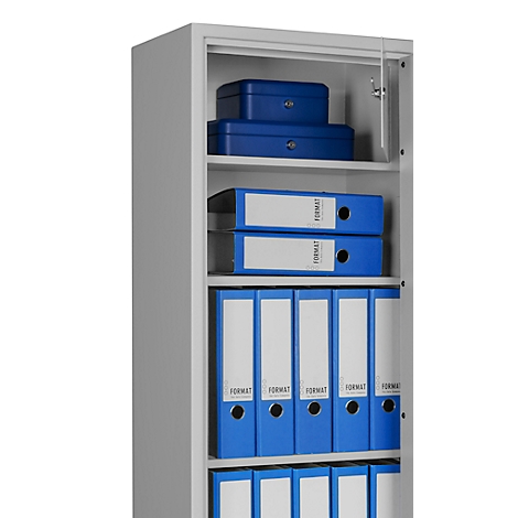 Grey filing cabinet, partially open, filled with blue folders and storage boxes.