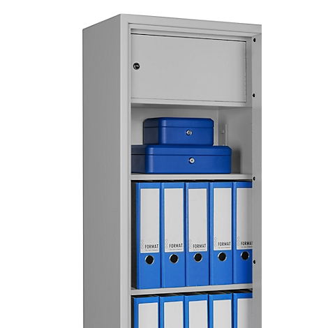 Grey filing cabinet, open, with blue binders, cash boxes, and a safe.