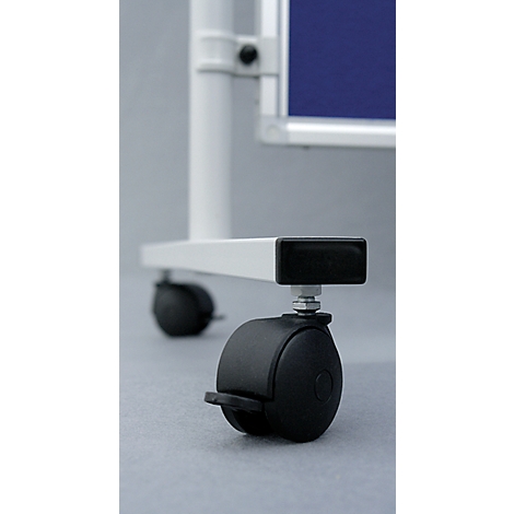 Close-up of the wheels of a whiteboard. Black wheels, white frame, blue background.