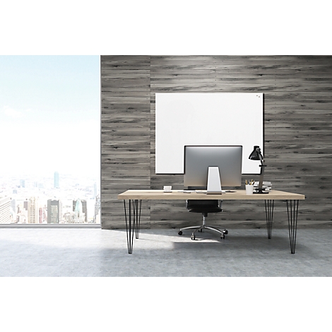 A modern desk with computer and office chair in front of a wood-look wall and a panoramic window with city view.