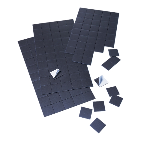 Black square adhesive pads, some with peel-off adhesive strips.