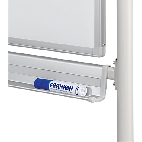 Close-up of a white whiteboard with a pen tray holding a blue Franken marker.