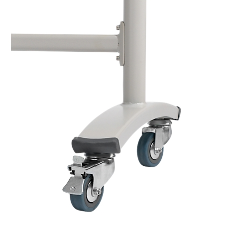 Close-up of a white furniture leg with two castors, one with a brake lever.