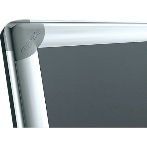 Corner of a gray whiteboard with a silver frame and the inscription 'FRANKEN'.