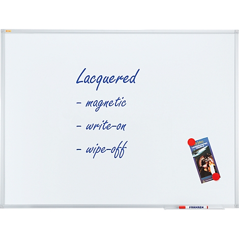 White whiteboard with blue text: 'Lacquered - magnetic - write-on - wipe-off'. A magnet holds a brochure.
