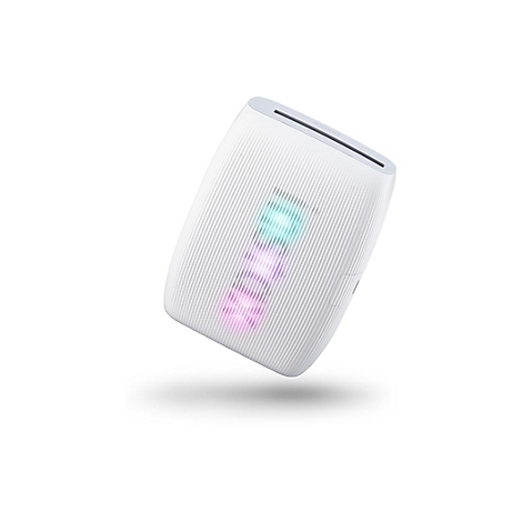 Appareil blanc, oblong, avec une surface nervurée et l'inscription 'TAILOX'. Un petit renfoncement sur le côté.