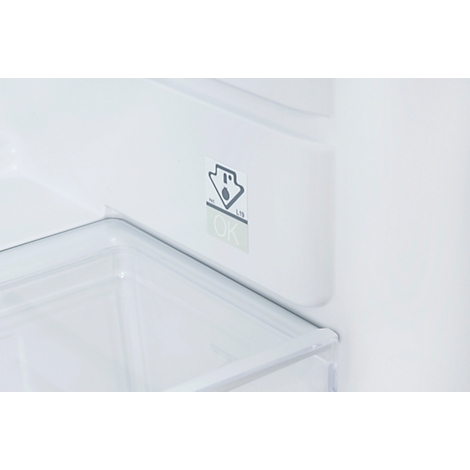 Close-up of a refrigerator. A sticker shows a droplet symbol and the inscription "OK".