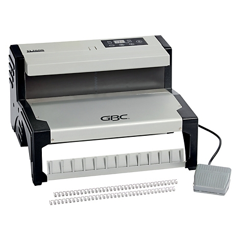 Machine à relier grise et noire avec pédale et peignes métalliques.