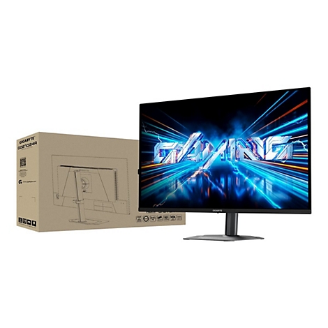 Gigabyte Gaming-Monitor mit leuchtend blauem Gaming-Schriftzug auf dem Bildschirm und zugehörigem braunen Versandkarton.