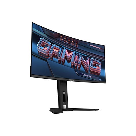 Ein Gaming-Monitor mit gekrümmtem Bildschirm, der auf einem Tisch steht. Auf dem Monitor steht groß das Wort "GAMING".