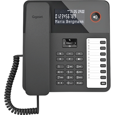 Téléphone noir avec écran, boutons et combiné. L'écran affiche la date, l'heure, le numéro de téléphone et le nom. Le téléphone dispose d'un bouton de combiné.