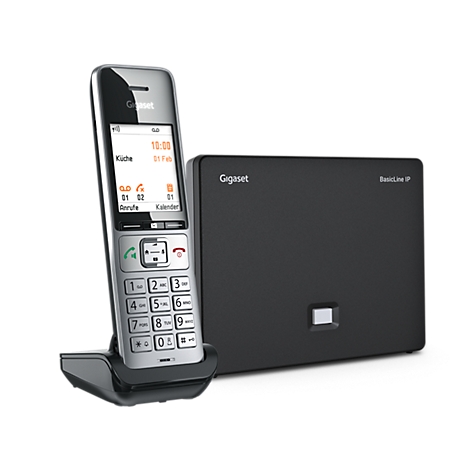 Gigaset DECT-Telefon mit silbernem Mobilteil in Ladestation und schwarzer Basisstation auf weißem Grund.