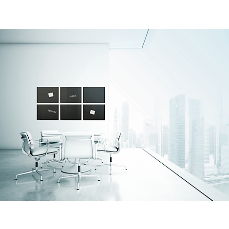 Bright conference room: table with chairs, blackboards with notes, large window view of city.