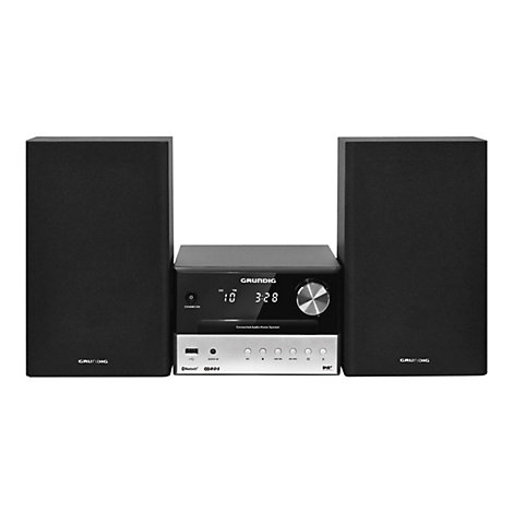 Grundig Kompaktanlage mit zwei schwarzen Lautsprechern und zentralem Bedienelement vor weißem Hintergrund.