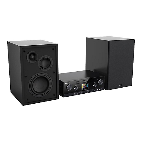 Schwarze Grundig Stereoanlage mit zwei Lautsprechern und zentraler Steuereinheit mit Display vor weißem Hintergrund.