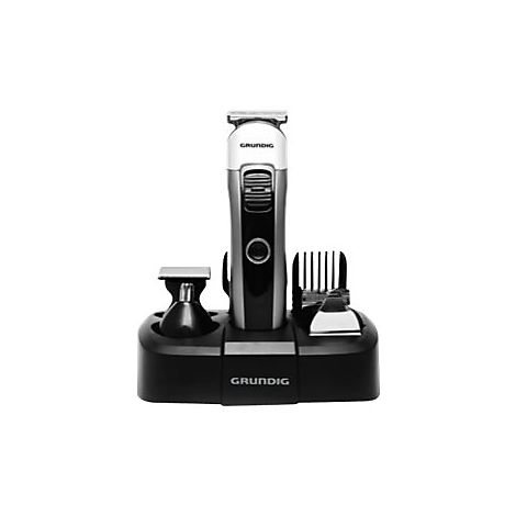 Grundig Trimmer auf schwarzer Ladestation mit Zubehör vor weißem Hintergrund.