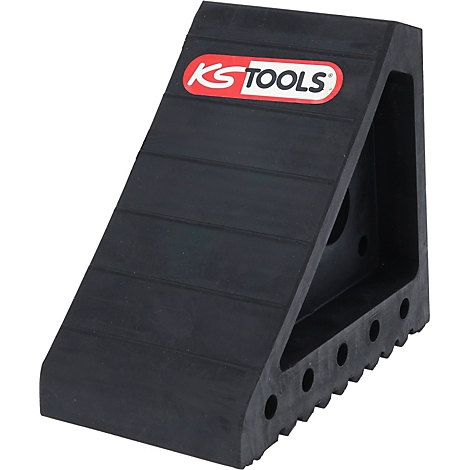 Schwarzer Unterlegkeil mit Logo KS TOOLS. Der Keil hat horizontale Rillen und eine gezahnte Unterseite.