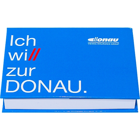 Blaues Notizbuch mit Text 'Ich will zur DONAU' und Logo. Darunter ein weißer Block.