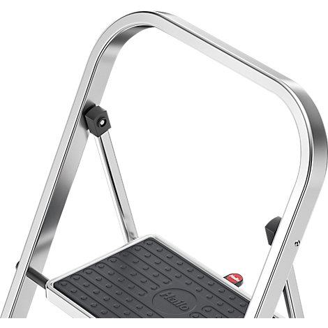 Close-up of a silver stepladder with a black step and handrail. The step says "HaLo".