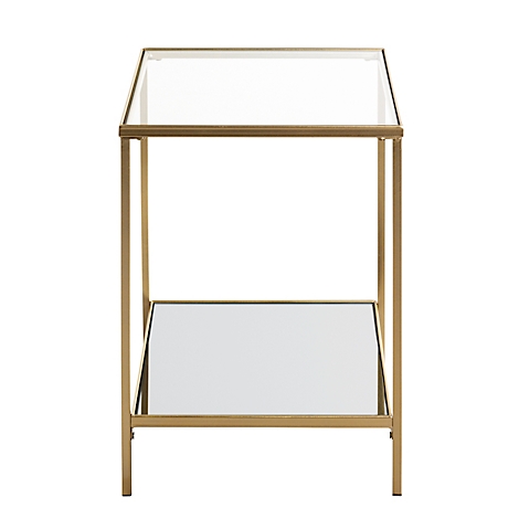 Gros plan sur un cadre métallique doré avec des plaques de verre, coin d'un meuble.