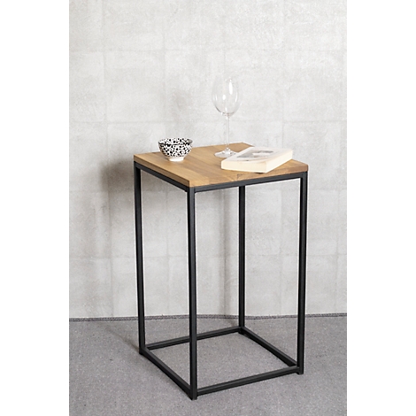 Table d'appoint avec plateau en bois, cadre en métal noir, verre, bol et livre. Fond gris.