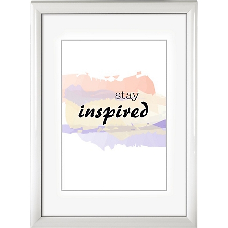 Une image encadrée avec les mots "Stay Inspired" sur un fond aquarelle coloré.