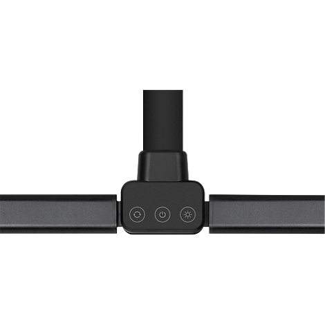 Nahaufnahme einer schwarzen Schreibtischlampe. Die Lampe hat einen T-förmigen Kopf mit drei Tasten und zwei horizontalen Armen.