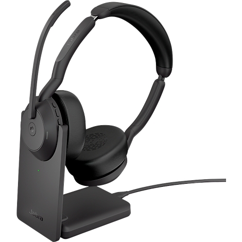 Wireless black headset with charging station. The earcup rests on the station, a microphone is extended.