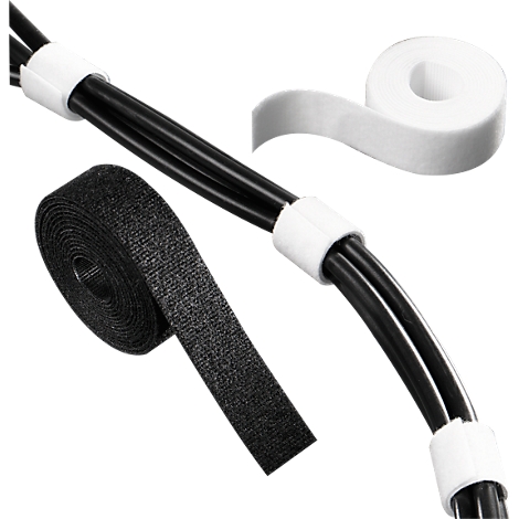 Black cables with white cable ties. Next to it Velcro roll and adhesive tape roll.