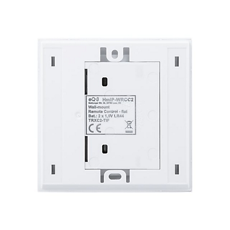 Weißes, quadratisches Wandbedienelement mit freiliegender Rückseite. Text: eQ-3 HmIP-WRCC2, Wall-mount, Remote Control, Bat.: 2x1,5V LR44.
