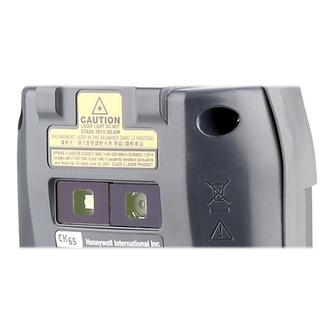 Gros plan d'un appareil Honeywell gris avec des autocollants, dont un avertissement de sécurité laser.