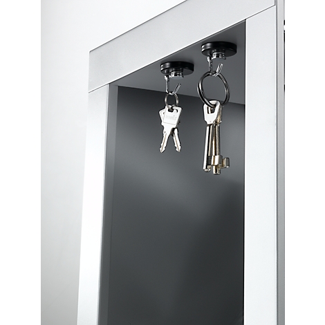 Two keychains hanging from magnets under a gray shelf.
