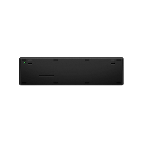 Schwarze Tastatur von unten. Mit Knöpfen, einer Batterieabdeckung und einem grünen Lämpchen.