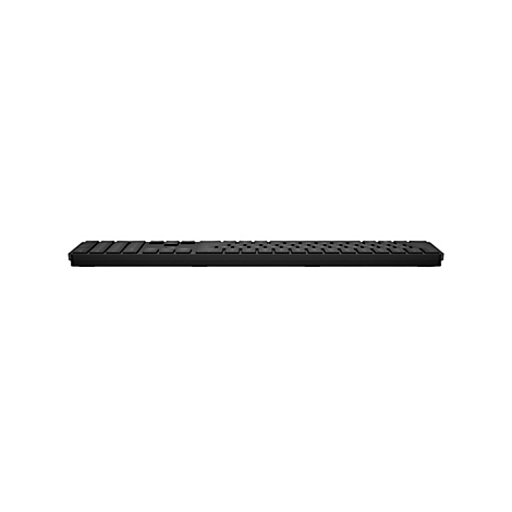 Flache, schwarze kabellose Tastatur in der Seitenansicht vor weißem Hintergrund.