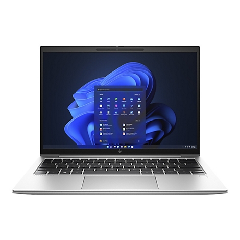 Ein silberner Laptop mit Windows 11-Oberfläche. Auf dem Bildschirm sind App-Symbole und das Windows-Logo zu sehen.