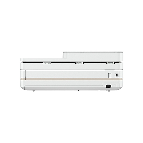 Vue latérale d'une imprimante crème. Il y a des ports sur la droite, une entrée sur le dessus.